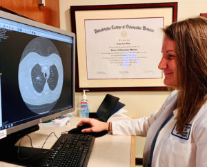 doctor looking at imaging in computer