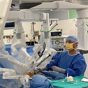 Doctor in operating room looking at monitor