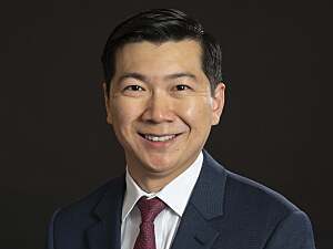 Headshot of Thomas C. Tsai, MD, MPH on black background