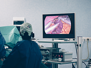 Bariatric surgery in operating room with surgeon looking at monitor
