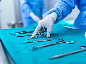 Medical hand reaching for surgical tools
