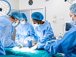 Diverse surgical team performing operation