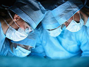 Team of surgeons in operating room