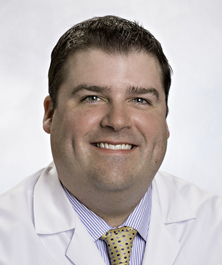 headshot photo of Dr. Carroll