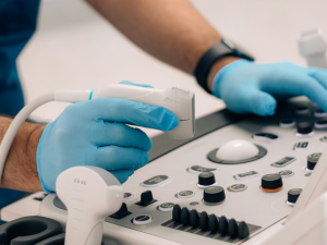 doctor working on an ultrasound machine