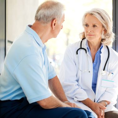 doctor sitting and talking with a patient